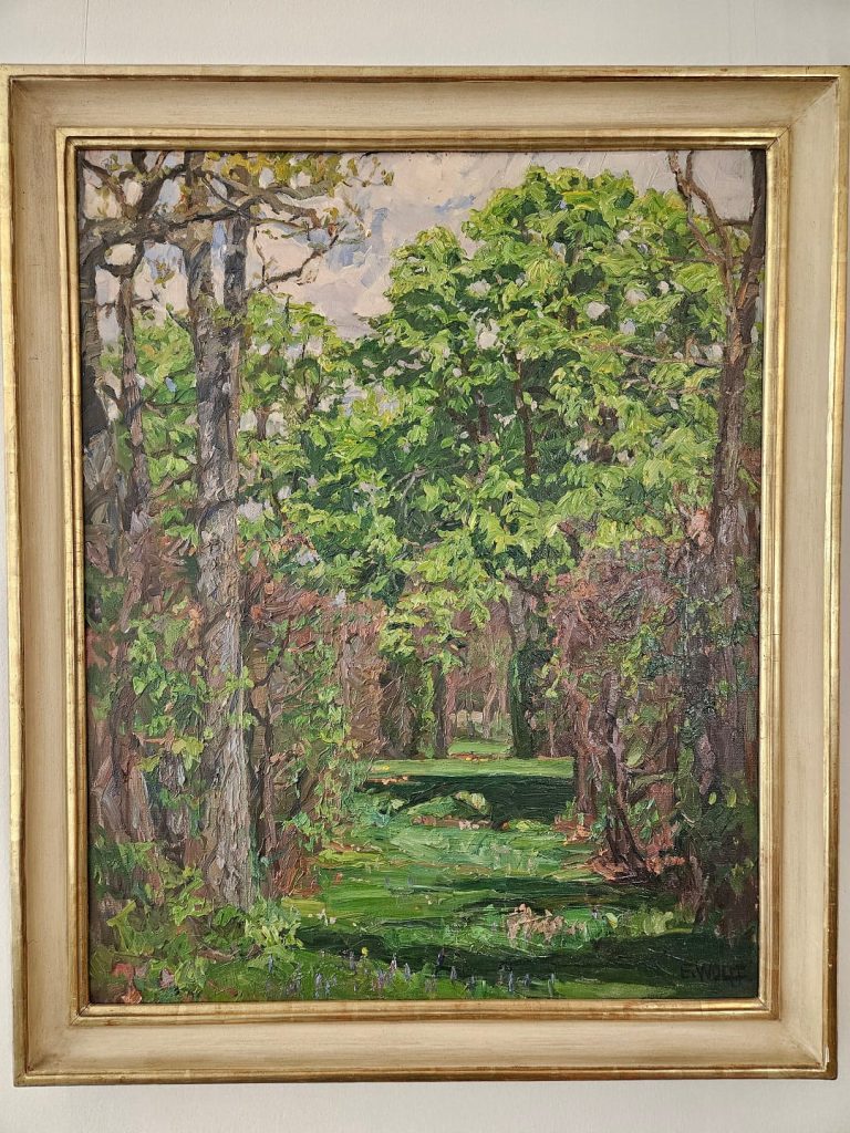Landschaftsgemälde von Eugen Wolff-Filseck mit dichtem grünen Baumbestand und einer lichtdurchfluteten Lichtung
